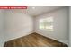 Bright, open living area featuring wood floors, a large window, and french doors at 11123 Cardinal Creek Ave, Charlotte, NC 28215