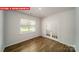 Bright, open living area featuring wood floors, a large window, and french doors at 11123 Cardinal Creek Ave, Charlotte, NC 28215