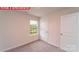 Bedroom featuring neutral carpet, white walls, trim and a window at 11204 Cardinal Creek Ave, Charlotte, NC 28215