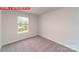 Bedroom featuring neutral carpet, white walls, trim and a window at 11204 Cardinal Creek Ave, Charlotte, NC 28215