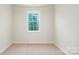 An empty bedroom featuring neutral walls, carpet and white trim at 119 Noah Ln, Troutman, NC 28166