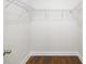 Empty walk-in closet with white wire shelving and wood flooring at 119 Noah Ln, Troutman, NC 28166