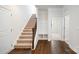 Entryway with carpeted stairs, wood floors and drop zone at 119 Noah Ln, Troutman, NC 28166