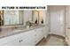 Stylish bathroom featuring double vanity, granite counters, and tile flooring at 121 Noah Ln, Troutman, NC 28166