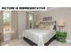 Well-lit bedroom with large windows and neutral decor at 121 Noah Ln, Troutman, NC 28166