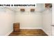 Walk-in closet with hardwood floors and wire shelving at 121 Noah Ln, Troutman, NC 28166