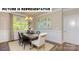 Elegant dining room with natural light and decorative wainscoting at 121 Noah Ln, Troutman, NC 28166