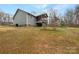 Exterior back elevation of home with deck, patio and spacious backyard at 121 Purple Finch Ln, Mooresville, NC 28117