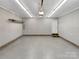 Spacious two-car garage with ample lighting, concrete flooring, and neutral color palette at 121 Purple Finch Ln, Mooresville, NC 28117