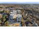 Aerial shot of modern apartment buildings surrounded by lush greenery at 19329 Watermark Dr # 551/552, Cornelius, NC 28031