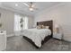 Cozy bedroom with brick-style accent wall, and decorative ceiling fan at 19329 Watermark Dr # 551/552, Cornelius, NC 28031