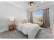 Comfortable bedroom with a large window, cozy bedding, and elegant finishes at 19329 Watermark Dr # 551/552, Cornelius, NC 28031