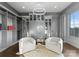 A closet showcases custom shelving, seating area, and abundant storage space in elegant gray tones at 19329 Watermark Dr # 551/552, Cornelius, NC 28031