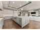 A kitchen with stainless steel appliances, an island with a sink and seating, and an open view to the living room at 19329 Watermark Dr # 551/552, Cornelius, NC 28031