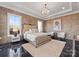 Lavish main bedroom with a decorative light fixture and tiled accent wall at 19329 Watermark Dr # 551/552, Cornelius, NC 28031