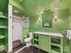 The bathroom features a walk-in shower, hexagon tiled floor, and modern vanity with marble countertop at 2109 Wellesley Ave, Charlotte, NC 28207