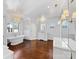 Luxurious bathroom featuring a standalone tub, glass shower, and elegant lighting at 2109 Wellesley Ave, Charlotte, NC 28207