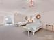 A bedroom features two beds with clean white bedding, ample space, and cozy decor for comfort and relaxation at 2109 Wellesley Ave, Charlotte, NC 28207