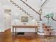 Elegant foyer showcasing hardwood floors and a staircase with decorative carpet at 2109 Wellesley Ave, Charlotte, NC 28207