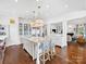 Expansive kitchen with a large island, high-end appliances, and ample cabinet space, open to living area at 2109 Wellesley Ave, Charlotte, NC 28207