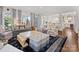 An open-concept living room with a fireplace, large windows, and stylish, colorful seating at 2109 Wellesley Ave, Charlotte, NC 28207