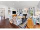 Bright living room with comfortable seating, fireplace, and decorative mirrors and sconces at 2109 Wellesley Ave, Charlotte, NC 28207