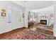 Bright living room with hardwood floors, fireplace, and view of the front door at 2109 Wellesley Ave, Charlotte, NC 28207