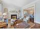 Comfortable living room features a fireplace, hardwood floors, and access to the dining room at 2109 Wellesley Ave, Charlotte, NC 28207