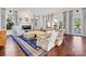 Spacious living room featuring a fireplace, large windows, and cozy seating arrangement at 2109 Wellesley Ave, Charlotte, NC 28207