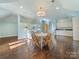 Open living area with wood floors, complemented by a cozy sitting area and convenient kitchenette at 2109 Wellesley Ave, Charlotte, NC 28207
