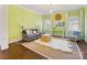 Bright and inviting living room with green walls, a comfortable sofa, and stylish decor at 2109 Wellesley Ave, Charlotte, NC 28207
