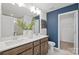 Bathroom featuring double vanity, white countertops, and ample lighting at 2230 Cobble Ct # 154, Monroe, NC 28110