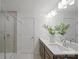 Bright bathroom with double sinks, quartz countertops, walk-in shower, and modern fixtures at 2230 Cobble Ct # 154, Monroe, NC 28110