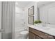 Bright bathroom featuring a shower-tub combo and a modern vanity with stylish fixtures and decor at 2232 Cobble Ct # 153, Monroe, NC 28110