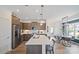 Spacious kitchen with stainless steel appliances, a center island, and an adjacent dining area at 2236 Cobble Ct # 151, Monroe, NC 28110