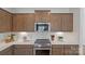 Modern kitchen featuring stainless steel appliances, sleek countertops, and ample cabinet space at 2236 Cobble Ct # 151, Monroe, NC 28110