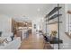 Open-concept living area flows into a modern kitchen with a large island and a cozy dining space at 2236 Cobble Ct # 151, Monroe, NC 28110