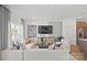 Bright and stylish living room featuring a comfortable sofa, large windows, and contemporary decor at 2236 Cobble Ct # 151, Monroe, NC 28110