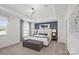 Serene main bedroom featuring tray ceilings, a plush bed, and a calming color palette at 2236 Cobble Ct # 151, Monroe, NC 28110