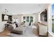 Bright and airy living room featuring a sectional sofa, large windows, and seamless flow to the dining area at 2241 Cobble Ct # 221, Monroe, NC 28110