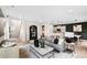 Inviting living room showcasing an open floor plan with modern décor and a seamless transition to the kitchen at 2241 Cobble Ct # 221, Monroe, NC 28110