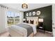Stylish main bedroom featuring a neutral color palette, elegant décor, and bright natural light at 2241 Cobble Ct # 221, Monroe, NC 28110
