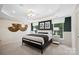 Bright bedroom with natural light, stylish decor, neutral colors, and tray ceiling at 2243 Cobble Ct # 222, Monroe, NC 28110