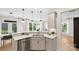Well-lit kitchen boasts stainless steel appliances, a quartz countertop, modern sink, and stylish fixtures at 2243 Cobble Ct # 222, Monroe, NC 28110