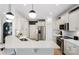 Modern kitchen featuring stainless steel appliances, white cabinets, quartz countertops, and a spacious island at 2243 Cobble Ct # 222, Monroe, NC 28110