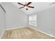 Bedroom featuring a large window, vaulted ceiling and neutral carpeting at 2321 Heathershire Ln, Matthews, NC 28105
