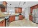 Modern kitchen with stainless steel appliances, granite countertops, ample storage and tile flooring at 2321 Heathershire Ln, Matthews, NC 28105