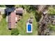 Aerial view of backyard pool, pool house, deck, patio and privacy in established neighborhood at 2360 Kings Grant Rd, Lincolnton, NC 28092