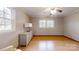 Bedroom featuring hardwood floors, a chair, a dresser, and a calm atmosphere at 2360 Kings Grant Rd, Lincolnton, NC 28092