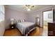 Bedroom featuring hardwood floors, a cozy bed, a mirror, and a calming atmosphere at 2360 Kings Grant Rd, Lincolnton, NC 28092